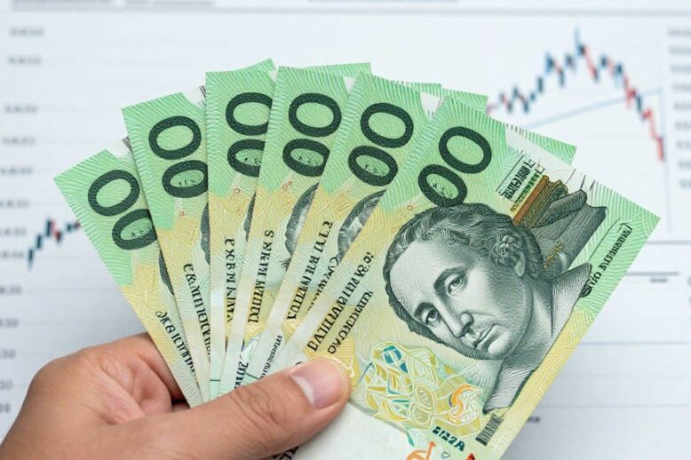 Australian dollars and financial charts